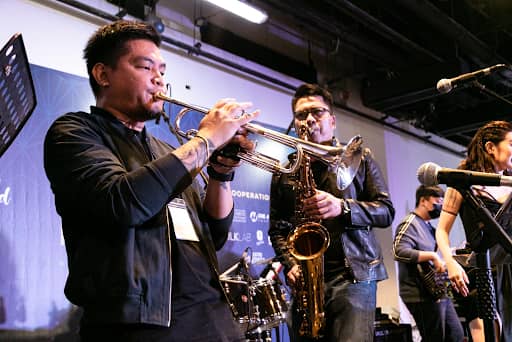 Musicians from Project 201, including saxophonist Mike Guevarra, at the 2023's MCF
Performance Theatre presenting jazz music for festival-goers to enjoy.