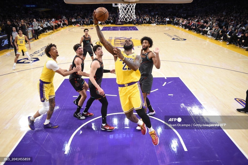 LeBron James #23 of the Los Angeles Lakers goes to the basket during the game on February 29, 2024, at Crypto.Com Arena in Los Angeles, California.
