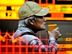 Most Asian markets fall after strong US data, eyes on inflation
