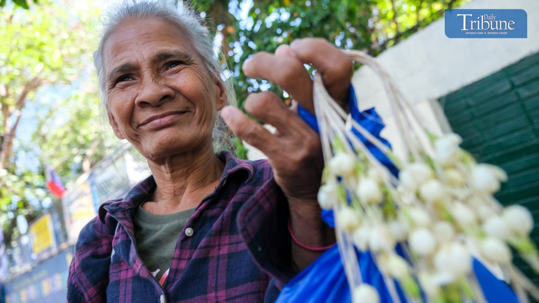 Badjao sells sampaguita