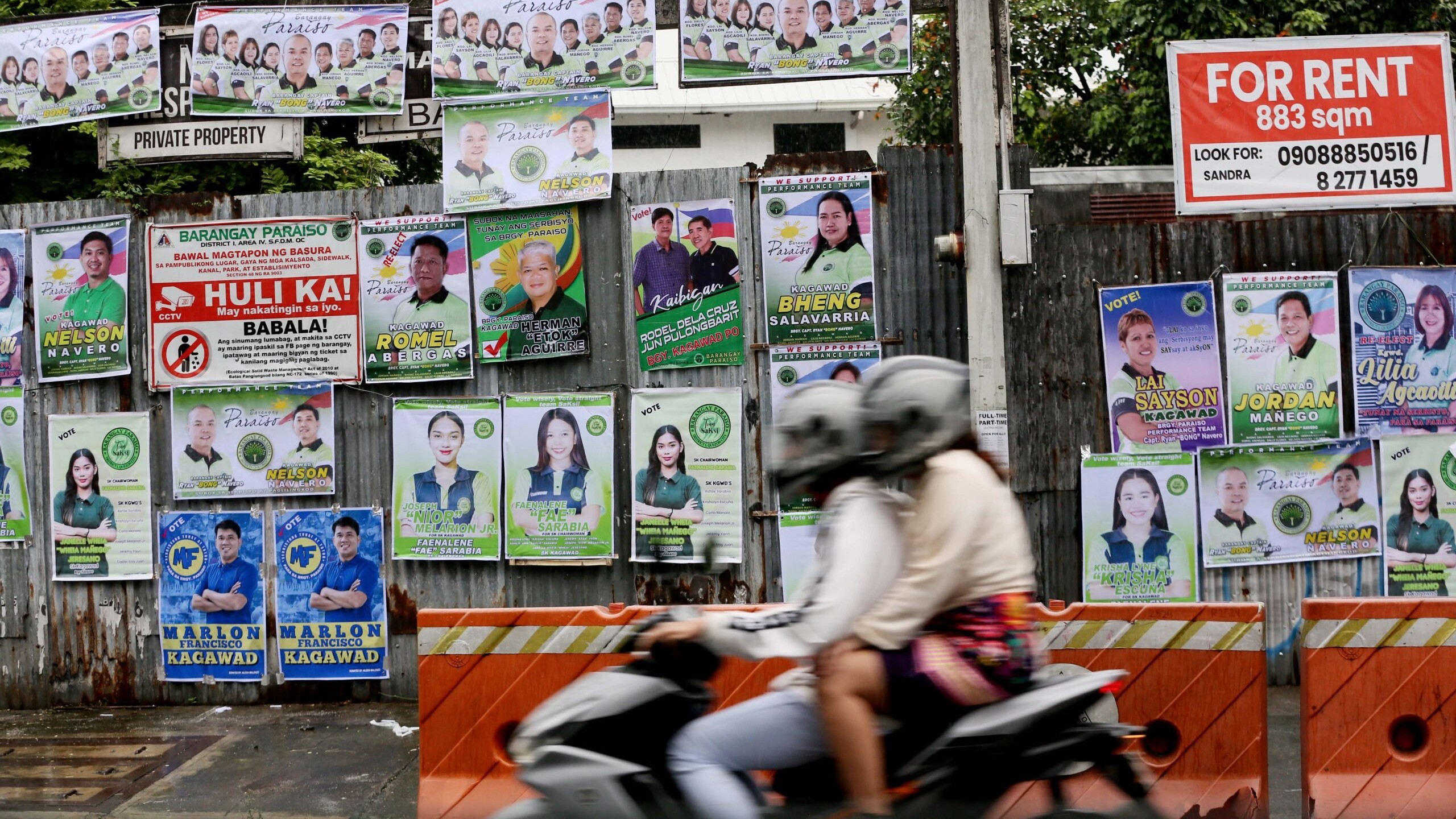 (FILES) Barangay Candidates start hanging a tarpaulin campaign in Quezon, on Thursday 19 October  2023.