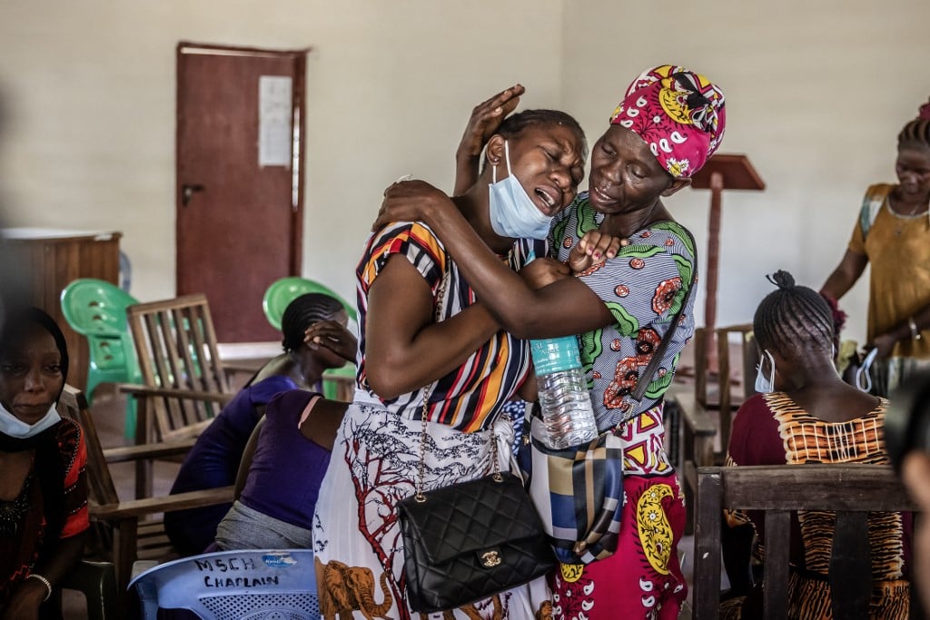 Members of a family mourn after receiving the remains of several family members who were victims of a Kenyan starvation cult at the Malindi Sub-County Hospital Mortuary in Malindi on 26 March 2024. Kenyan authorities on 26 March 2024 released several bodies of worshippers linked to a doomsday starvation cult case dubbed as the "Shakahola forest massacre" that shocked the country and the world. The remains are the first to be handed over to their families after nearly a year of painstaking work to identify them using DNA.