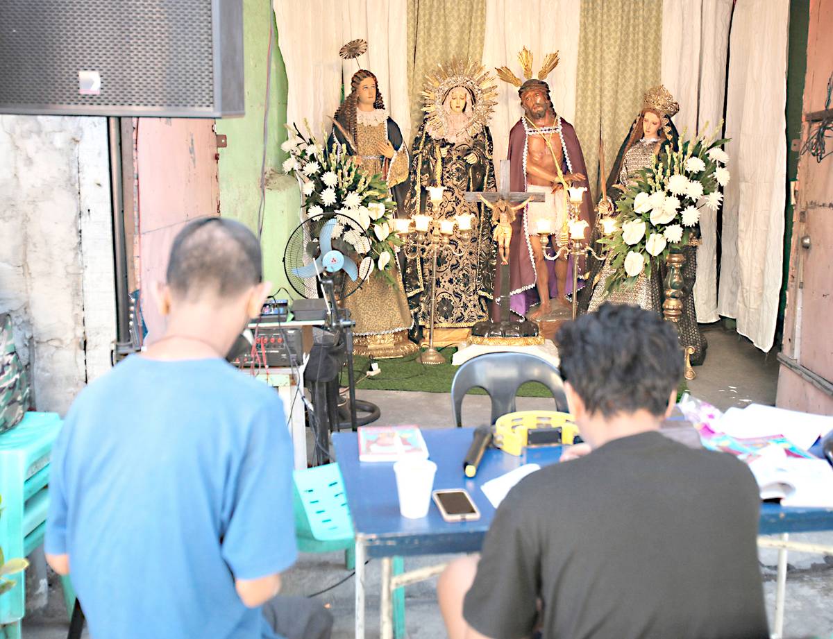 Residents of Barangay 75 in Tondo, Manila, gather for the popular devotion ‘Pabasa ng Pasyon’ or Reading of the Passion — a nonstop chant recounting Jesus Christ’s life, death and resurrection.