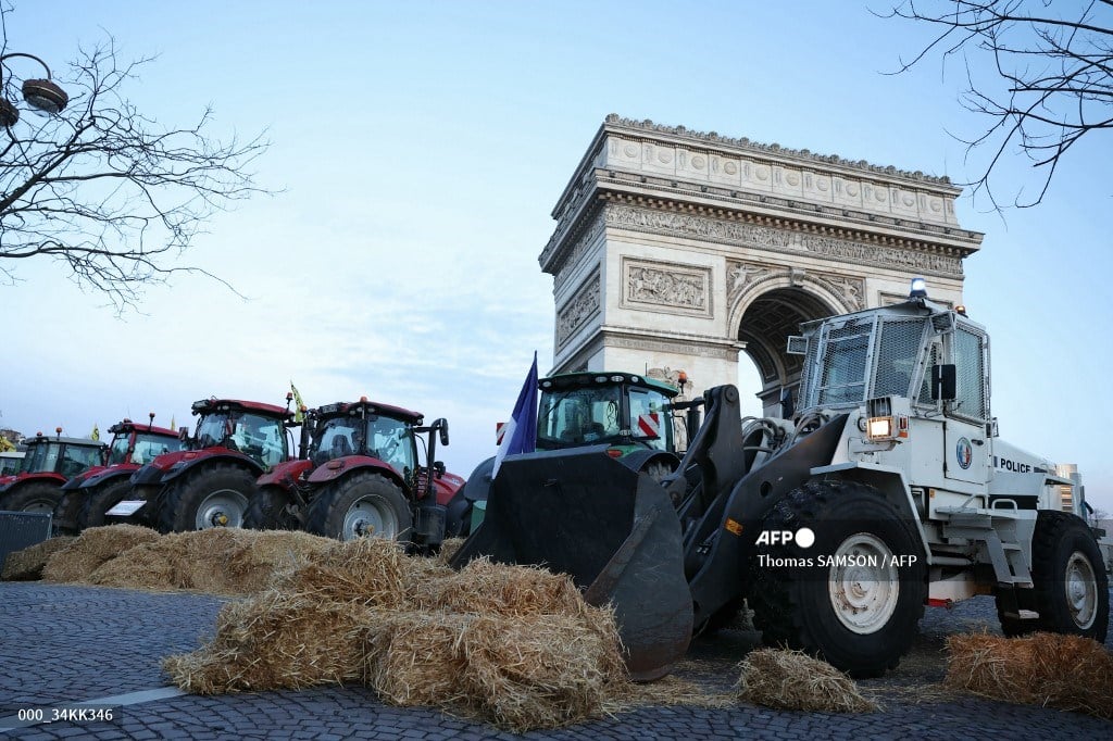 French farmers protest near Paris's Arc de Triomphe