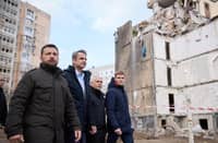 (FILE PHOTO) Ukraine's President Volodymyr Zelensky, left, and Greece's Prime Minister Kyriakos Mitsotakis, second from left, walking in front of a residential building damaged as a result of a Russian drone attack in Odesa on 6 March, 2024.