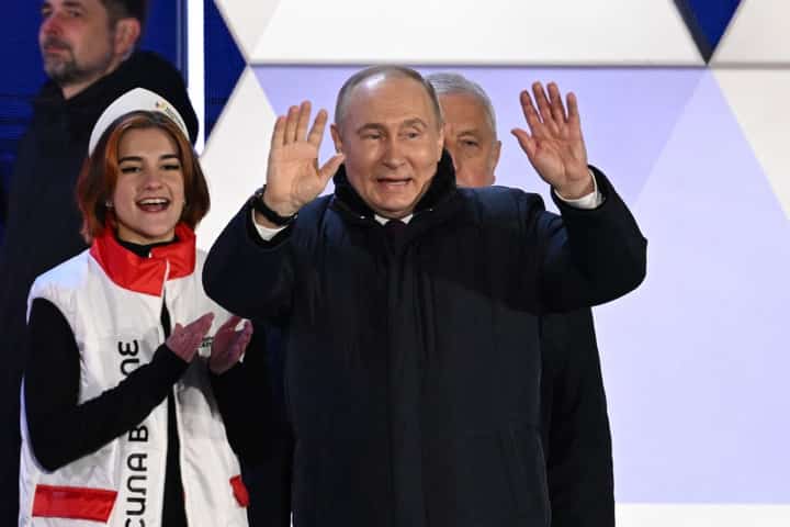 Russian President and presidential candidate Vladimir Putin addresses the crowd during a rally and a concert celebrating the 10th anniversary of Russia's annexation of Crimea at Red Square in Moscow on March 18, 2024.