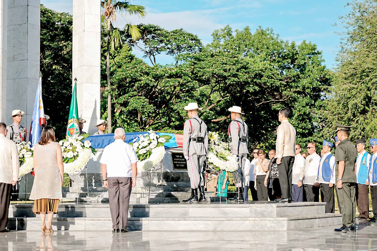 A solemn wreath-laying follows a sunrise ceremony led by the Department of National Defense and Philippine Veterans Affairs Office