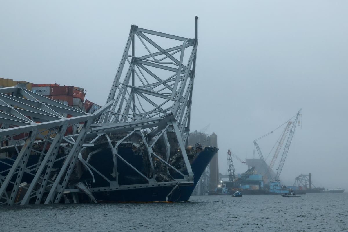 First vessel passes near collapsed channel bridge