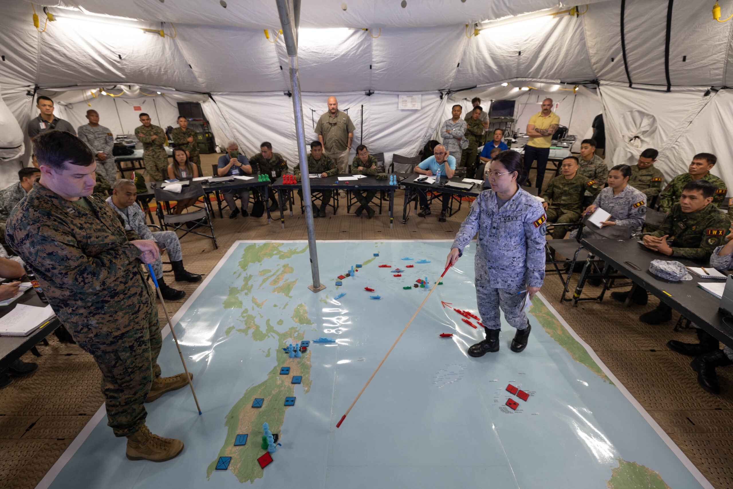 Lt. Cmdr. Maria Christina Roxas, Chief of External Affairs Branch of the Philippine Navy’s Public Affairs Division, briefs her team’s Information Operation plan to participants during the Information Warfighter Exercise ahead of Exercise Balikatan 24
