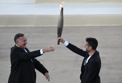 Greece hands Olympic flame to 2024 Paris Games hosts