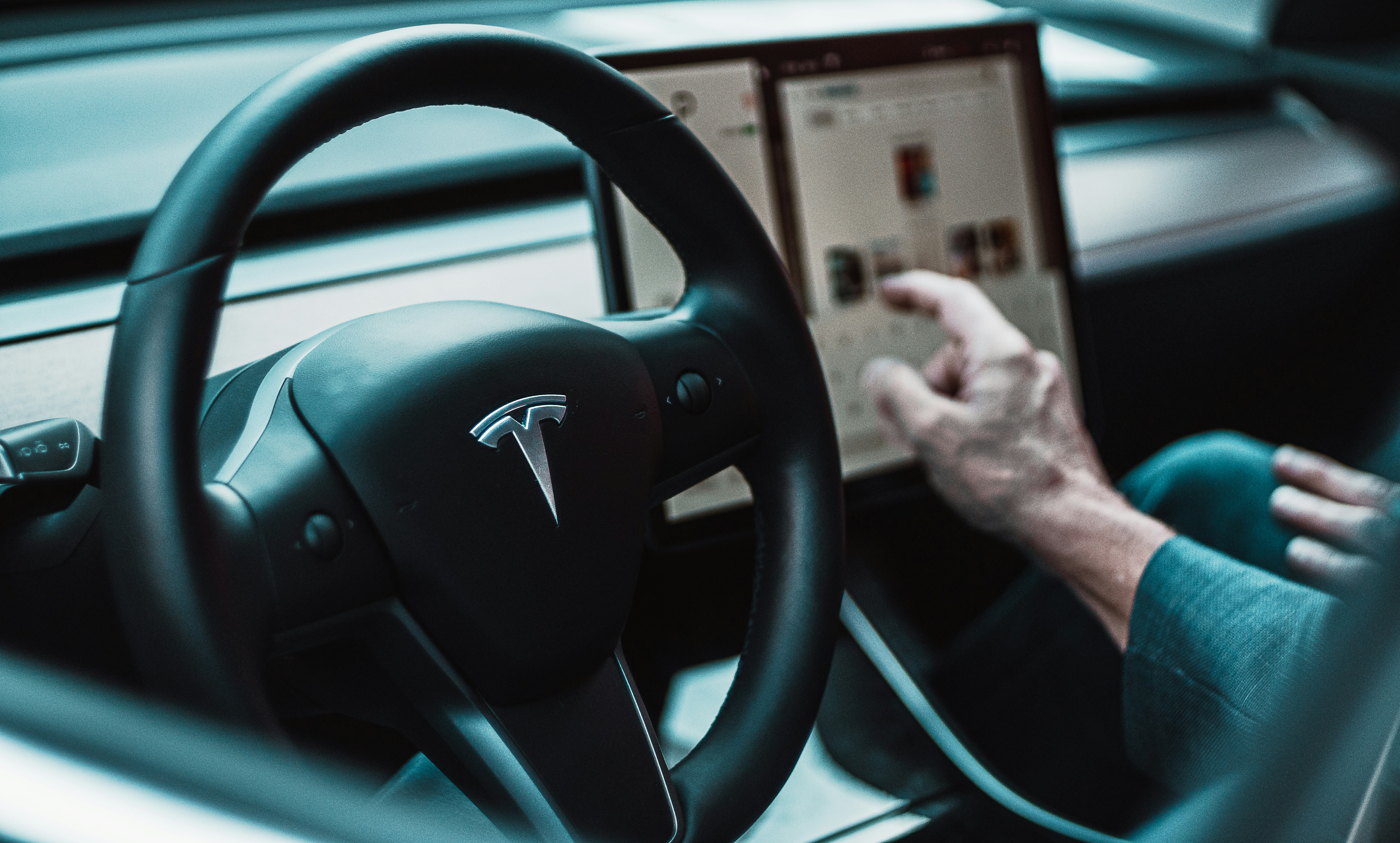 Tesla reports drop in auto sales, while Toyota sees US surge
