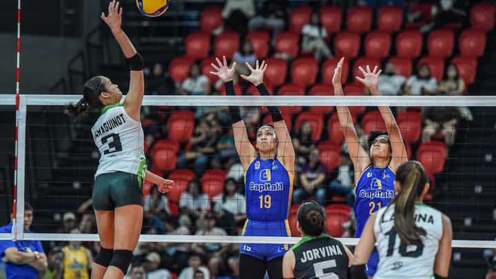 CAMILLE Victoria of Nxled attacks the defense of Jorelle Singh and Shirley Salamagos of Capital1 during their PVL All-Filipino Conference match yesterday. The Chameleons prevailed, 25-13, 25-23, 25-22.