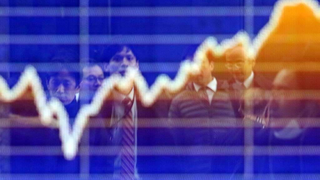 Asian markets mostly rise as traders weigh rate outlook