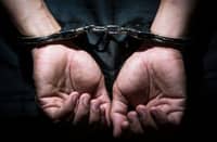Tribune-arrested-in-handcuff