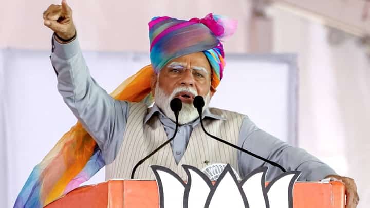 Indian Prime Minister Narendra Modi addresses supporters during an election campaign rally in Pushkar, India, on April 6, ahead of the country's upcoming general election starting Friday.