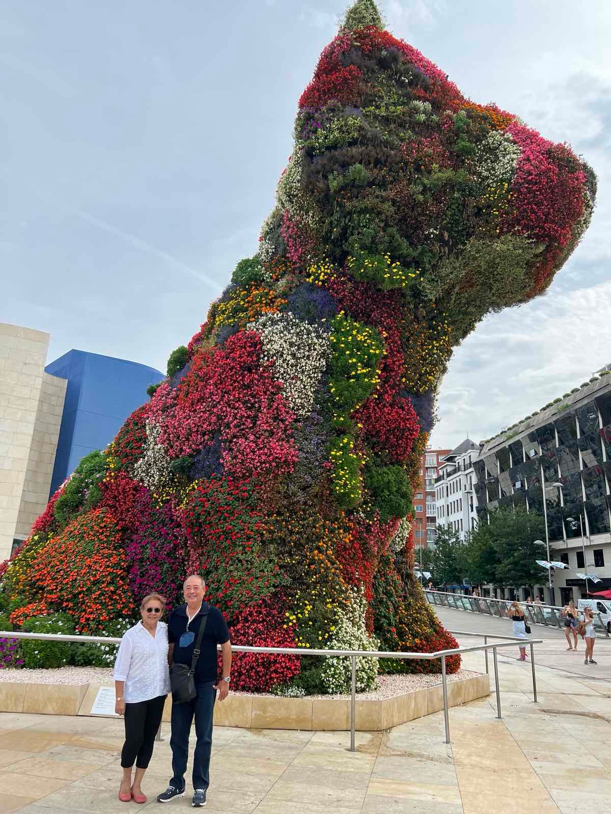 Adela Jarque and Freddie Alquiros beside the Puppy by Jeff Koons