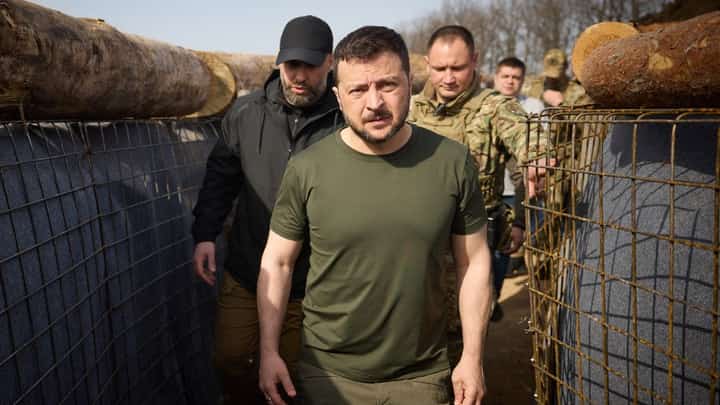 This handout photograph taken and released by Ukrainian Presidential Press Service on 9 April 2024, shows Ukraine's President Volodymyr Zelensky visiting the construction site of a defense line in Kharkiv region, amid the Russian invasion of Ukraine.