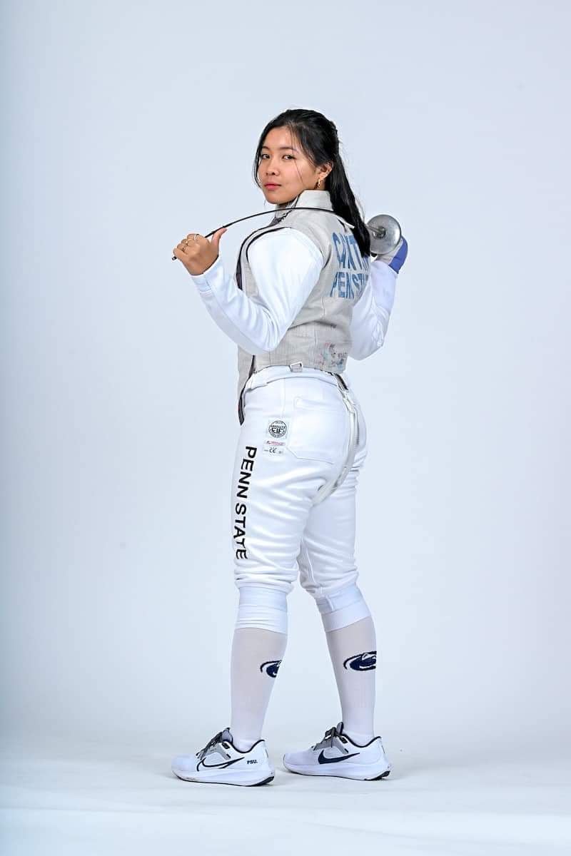Woman in fencing attire