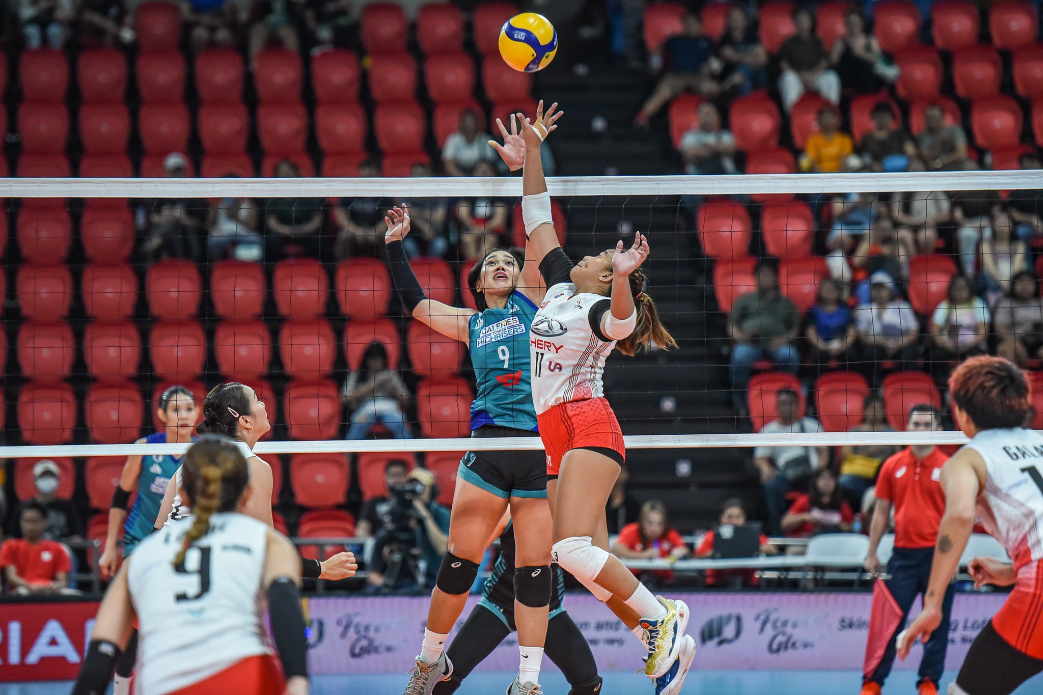 ALINA Bicar of Chery Tiggo and Audrey Paran of Galeries Tower engage in a joust during their PVL All-Filipino Conference game. The Crossovers prevailed,  26-24, 23-25, 19-25, 25-12, 15-9.