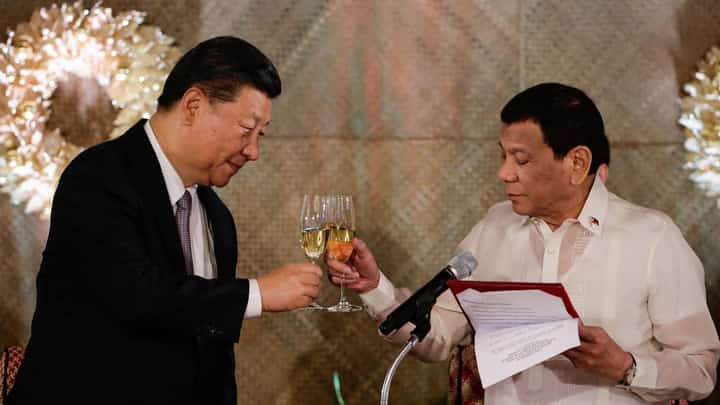 Chinese President Xi Jinping (left) and then-President Rodrigo Duterte toast good relations between Beijing and Manila during the former's visit to Malacanang Palace in 2018.