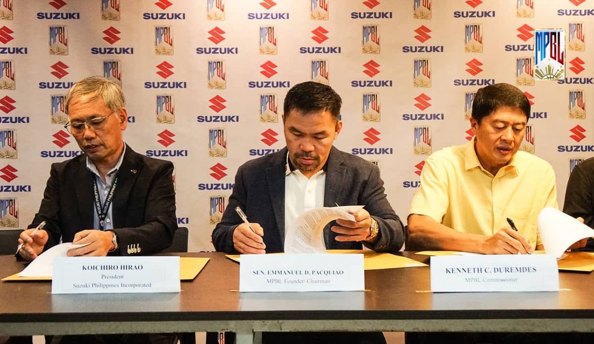MANNY Pacquiao (center) signs the agreement with Suzuki Philippines Inc., as founder and chairman of  the Maharlika Pilipinas Basketball League along with SPI president Koichiro Hirao (left) and MPBL commissioner Kenneth Duremdes.