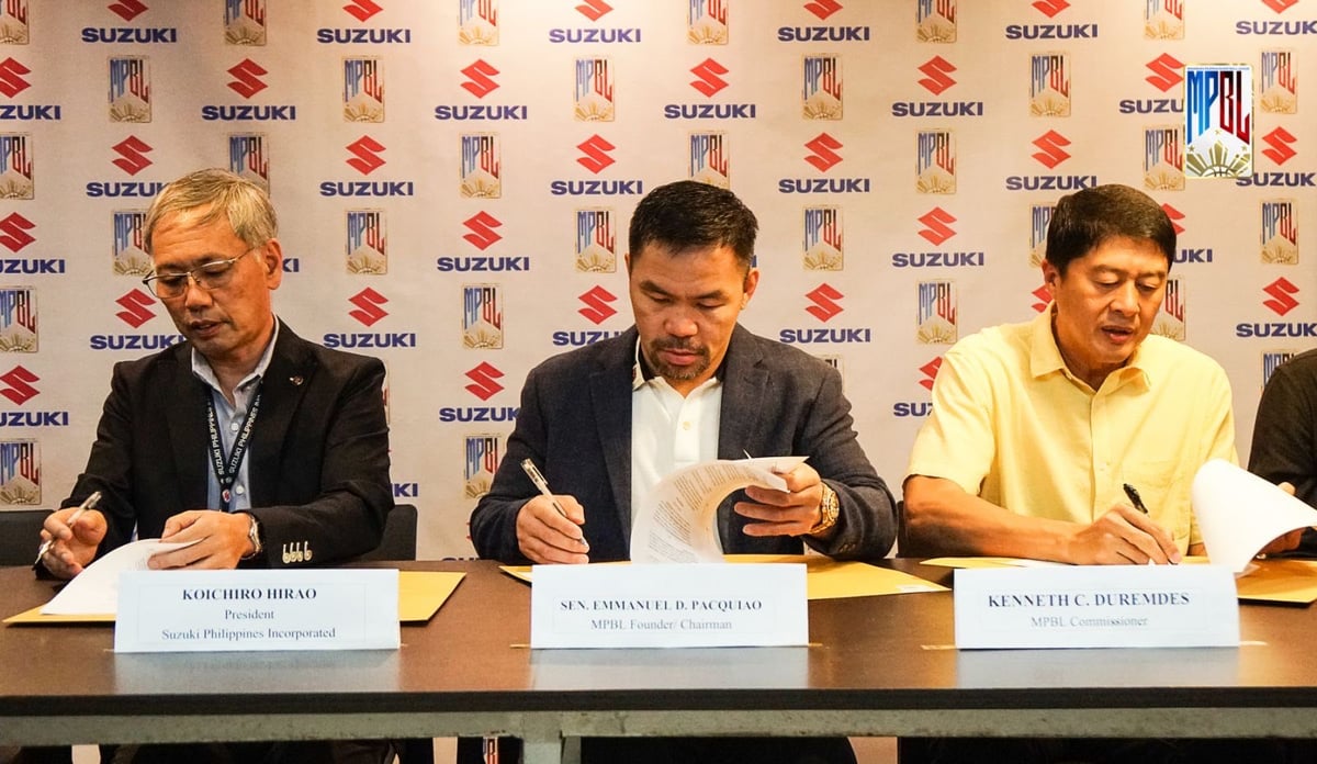 MANNY Pacquiao (center) signs the agreement with Suzuki Philippines Inc., as founder and chairman of the Maharlika Pilipinas Basketball League along with SPI president Koichiro Hirao (left) and MPBL commissioner Kenneth Duremdes.