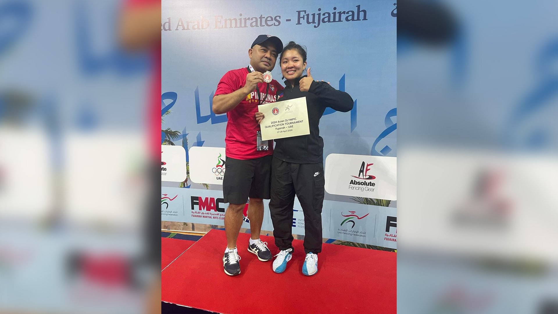SAMANTHA Catantan (right) offers her victory to her coach, Amatov Tuyay Canlas.