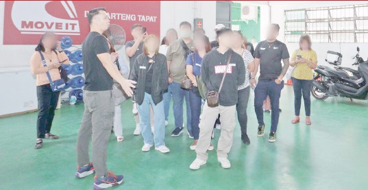 Participants of the forum take a quick tour of the MOVE IT safety facility