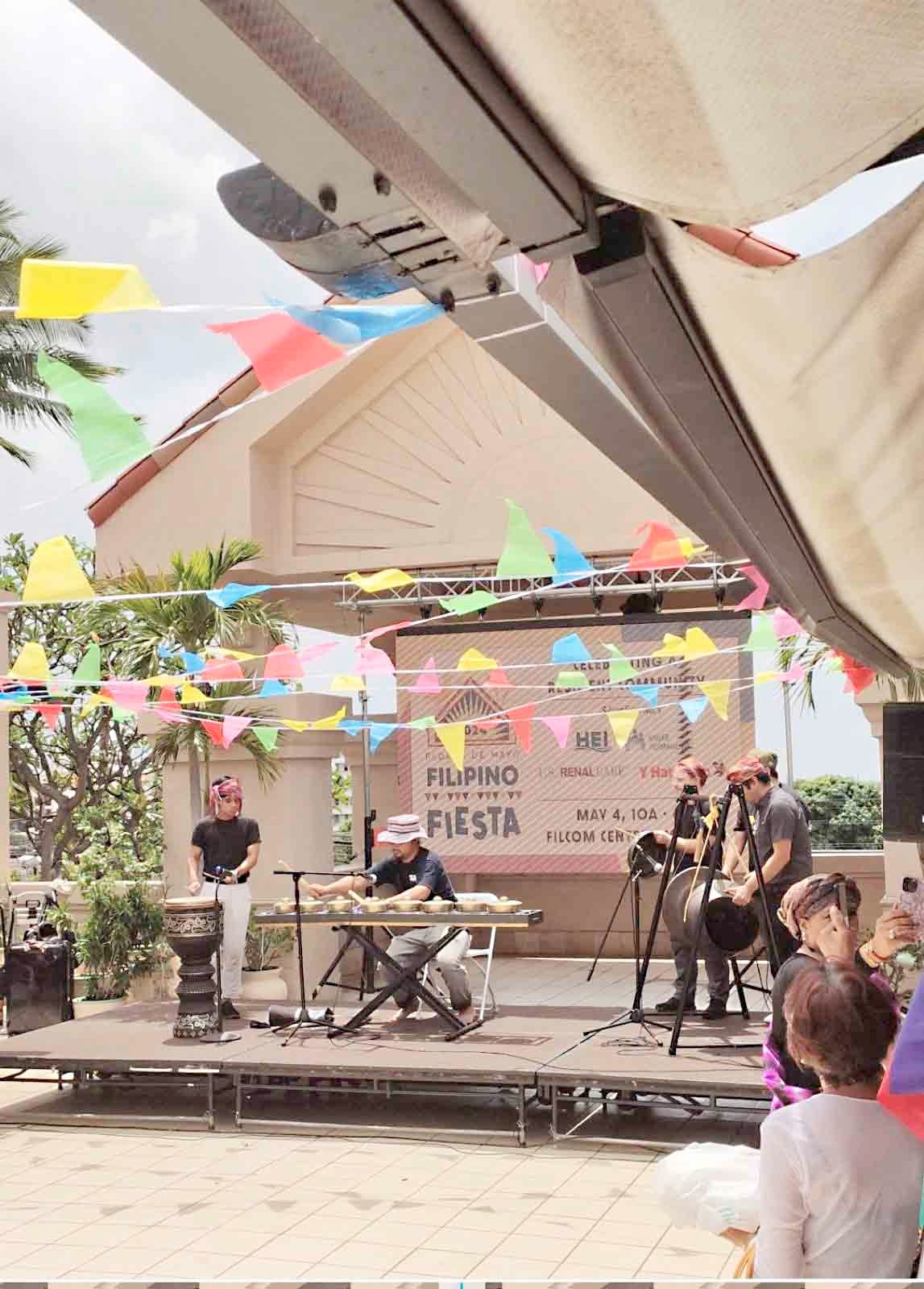 Filipino musicians showcased their talents with kulintang, a modern term for an ancient instrumental form of music composed on a row of small, horizontally laid gongs that function melodically, accompanied by larger suspended gongs and drums.