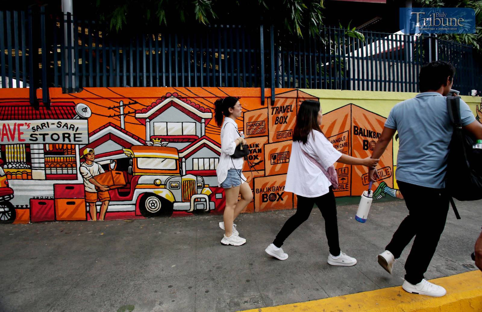 A mural depicting the journey of a migrant worker