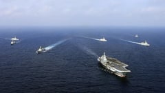 China shoos U.S. ship as Taiwan holds live-fire drill