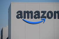 FILE PHOTO: The US giant Amazon logo is pictured on the opening day of a new distribution center in Augny on 23 September 2021. Photo by SEBASTIEN BOZON / AFP