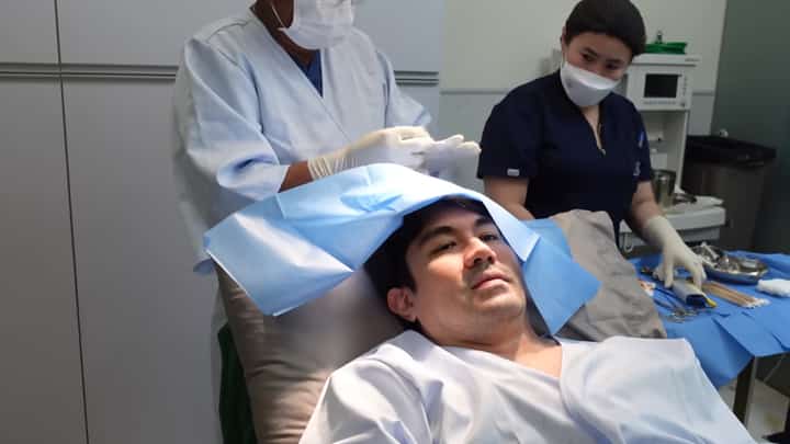 LUIS Manzano undergoes checkup on what is believed to be a lump on his head.