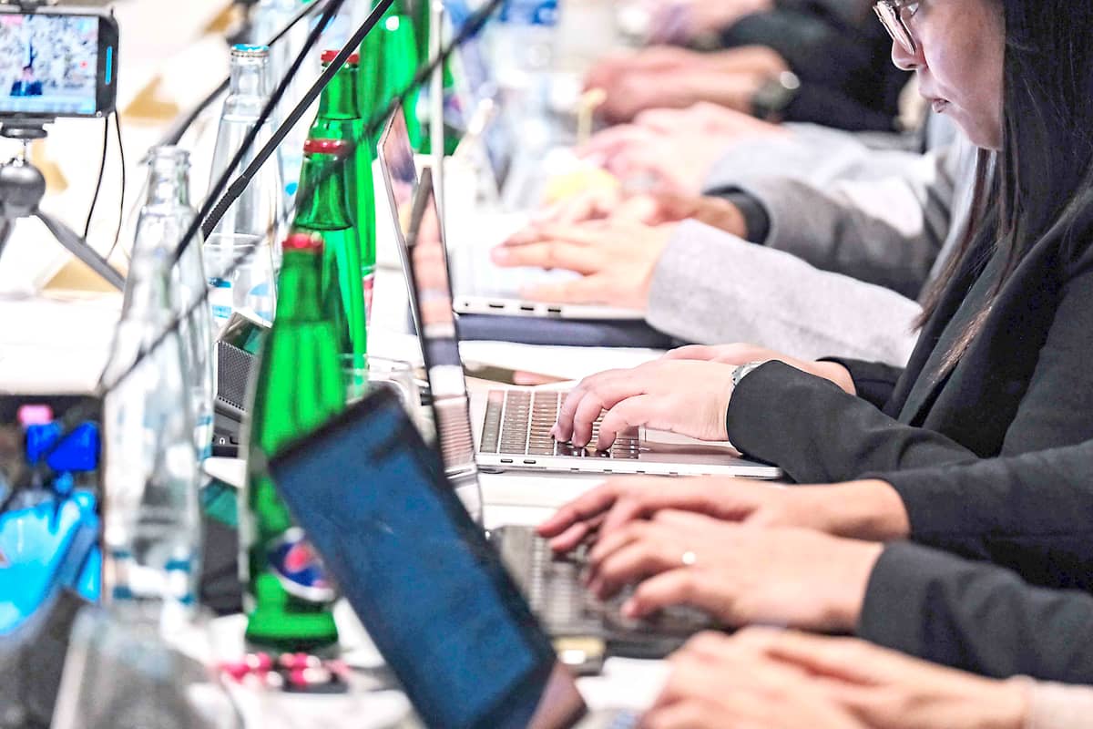 Members of the Malacañang Press Corps included in President Ferdinand Romualdez Marcos Jr.'s trip to Prague attentively listens to his answers during the Kapihan as they type away in March 2024.