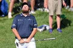 SIZZLING SHOTMAKING: Lowry fires 62; Schauffele, Morikawa share lead