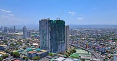 DMCI tops off Allegra Garden Place’s Soraya building