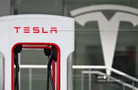 (FILES) A Tesla electric vehicle charging stall stands at a Tesla Supercharger location in Santa Monica, California on 15 May 2024.