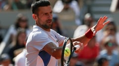 Djokovic tempers Paris expectations