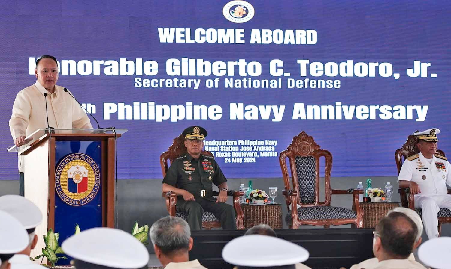 Navy Flag Officer in Command Toribio Adaci Jr., AFP Chief of Staff General Romeo Brawner Jr., and Defense Secretary Gilberto Teodoro Jr. (at rostrum) lead the celebration of the Philippine Navy's 126th founding anniversary on Friday, 24 May at the Philippine Navy headquarters in Manila.