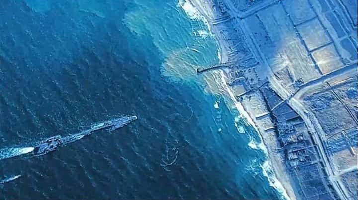 This handout picture courtesy of the US Central Command (CENTCOM) taken on May 16, 2024 shows US Army Soldiers assigned to the 7th Transportation Brigade (Expeditionary), US Navy Sailors assigned to Amphibious Construction Battalion 1, and Israel Defense Forces emplace the Trident Pier on the Gaza coast.