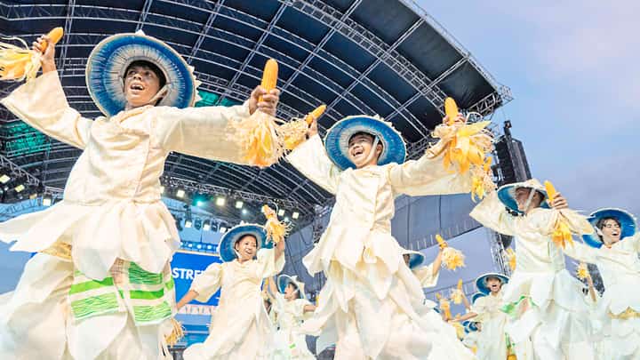 Contingents from different barangays of the City of Ilagan, Isabela perform street dance at the Ilagan Sports Complex on 10 May.