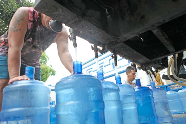 WATER containers line up along United Nations Avenue in this file photo. The head of the Metropolitan Waterworks and Sewerage System is in hot water over alleged irregularities.