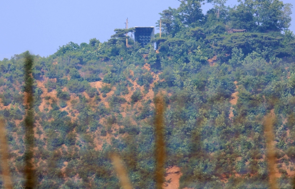 North Korea building roads, walls inside DMZ