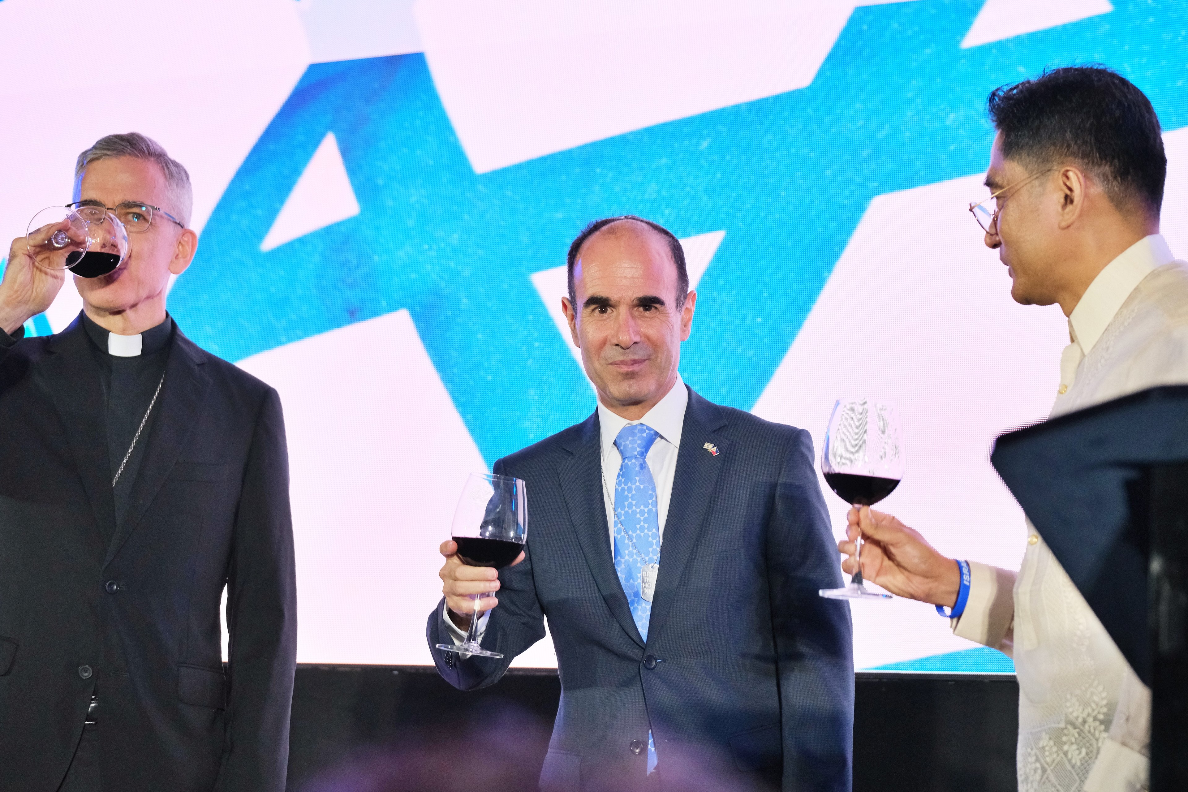A special toast was held for Philippines-Israel relations headed by Ambassador Ilan Fluss (center), with DFA Assistant Secretary and Chief of Pastoral Ariel Peñaranda (right), and Dean of the Diplomatic Corps Apostolic Nuncio Archbishop Charles Brown.