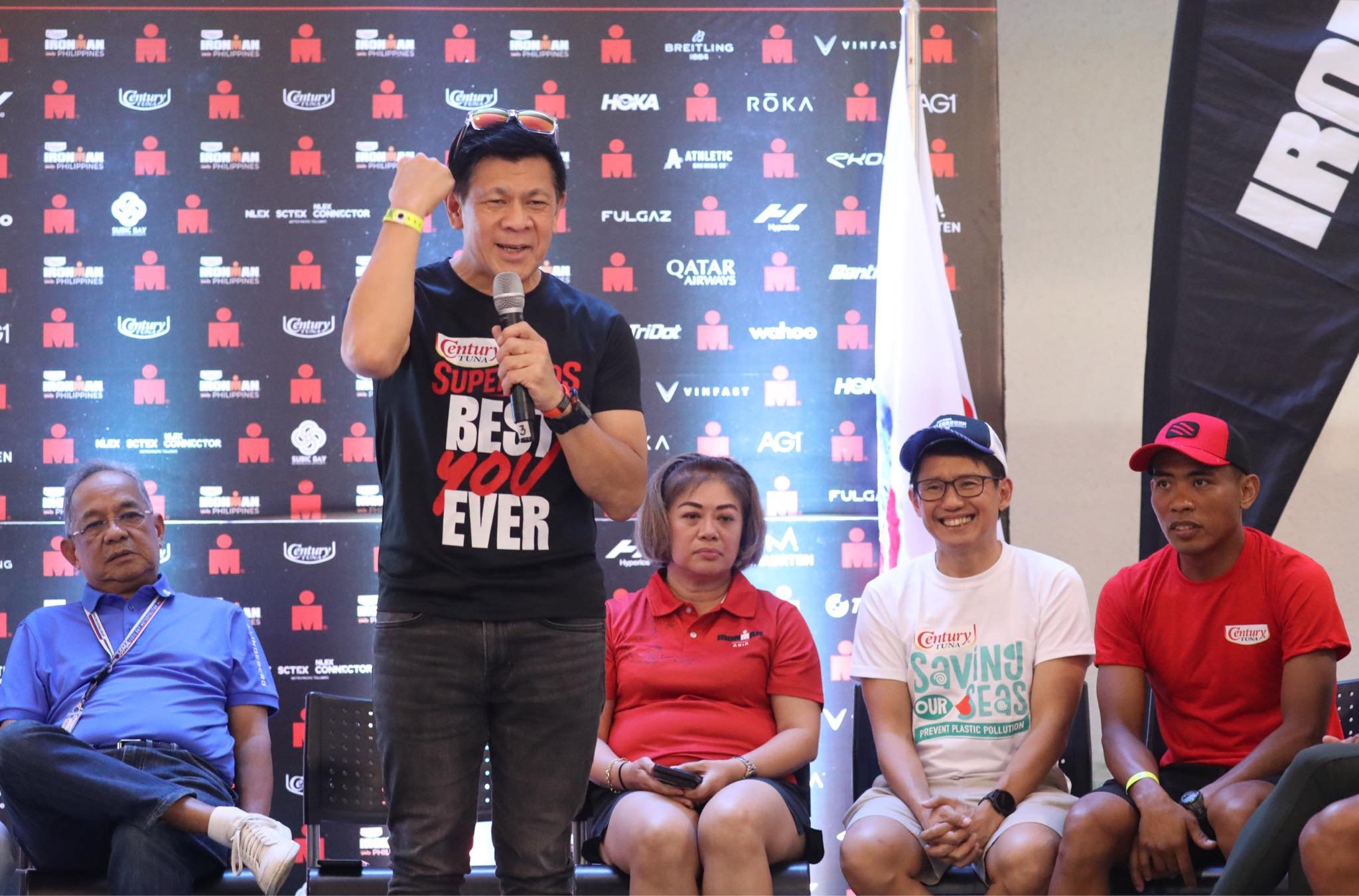 GREG Banzon, executive vice president and COO of Century Pacific Food Inc., emphasizes key points during the Century Tuna IRONMAN Philippines press conference. Also shown are (from left) SBMA chairman Eduardo Jose Alino, IRONMAN Group chief Princess Galura, Century Pacific Food Inc. executive Carlo Endaya, and top Filipino triathlete August Benedicto.