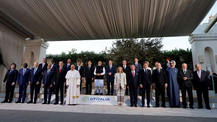(First row Left side) Argentine's President Javier Milei, Kenya's President William Ruto, US President Joe Biden, Mauritania's President Mohamed Ould Ghazouani, Turkish President Recep Tayyip Erdogan and Pope Francis (6th-L) and (First row Right side - From L) Italy's Prime Minister Giorgia Meloni, Jordan's King Abdullah, France's President Emmanuel Macron, Algeria's President Abdelmadjid Tebboune, United Arab Emirates’ President Sheikh Mohamed bin Zayed Al Nahyan, Brazilian President Luiz Inacio Lula da Silva, UN Secretary-General Antonio Guterr (Second row), President of the European Council Charles Michel (3rd-L), British Prime Minister Rishi Sunak (4th-L), Japanese Prime Minister Fumio Kishida (5th-L), India's Prime Minister Narendra Modi (6th-L), German Chancellor Olaf Scholz (7th-L) and Canada's Prime Minister Justin Trudeau (8th-L) pose for a family photo with G7 heads of States and heads of delegation of Outreach countries at Borgo Egnazia resort during the G7 Summit hosted by Italy, in Savelletri, on June 14, 2024.