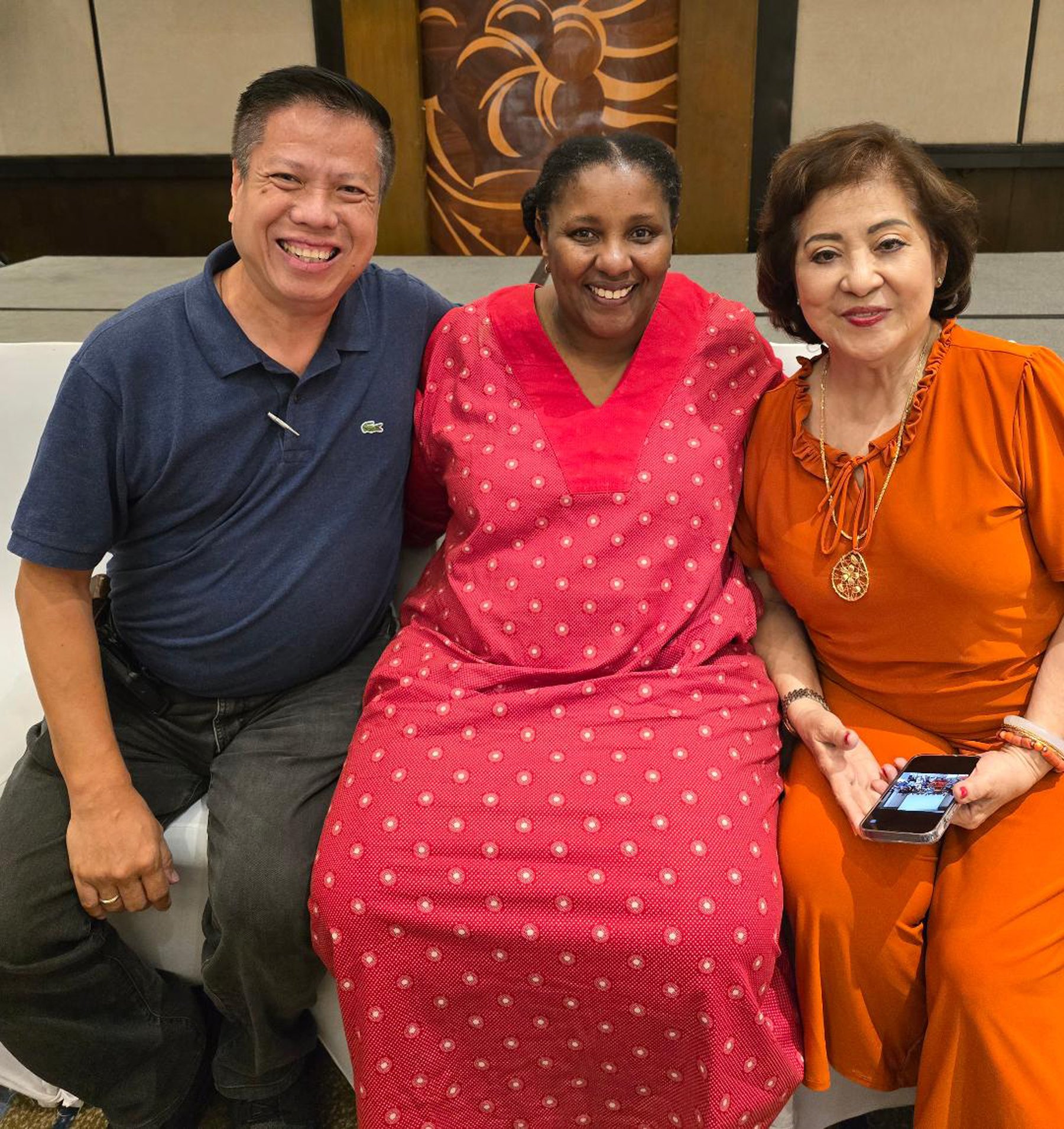 Neliswa Nkani  flanked by Alan Carvajal and Aida Uy.