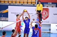 OWA Retamar of Alas Pilipinas tries to elude the defense of a Chinese blocker during their AVC Challenge Cup game late Sunday. The Chinese prevailed, 25-19, 25-22, 25-22.