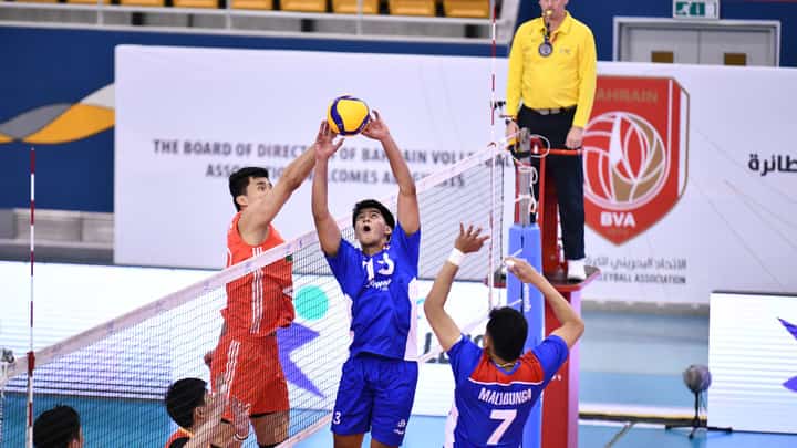 OWA Retamar of Alas Pilipinas tries to elude the defense of a Chinese blocker during their AVC Challenge Cup game late Sunday. The Chinese prevailed, 25-19, 25-22, 25-22.