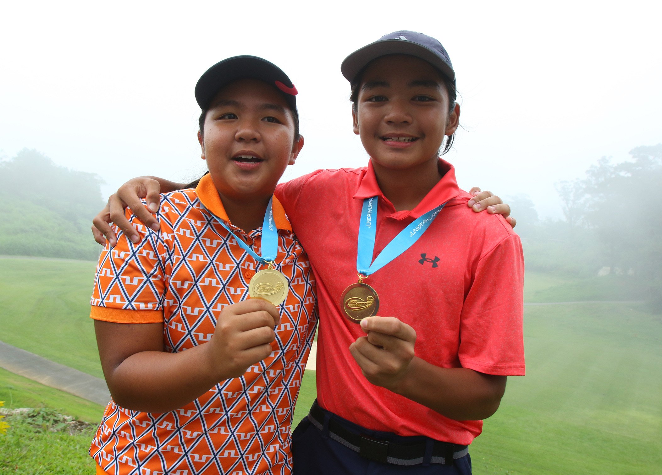 LISA and Vito Sarines celebrate after sweeping the girls and boys’ 11-14 category in the JPGT Luzon Series 3 at the Pinewoods Golf and Country Club in Baguio City.